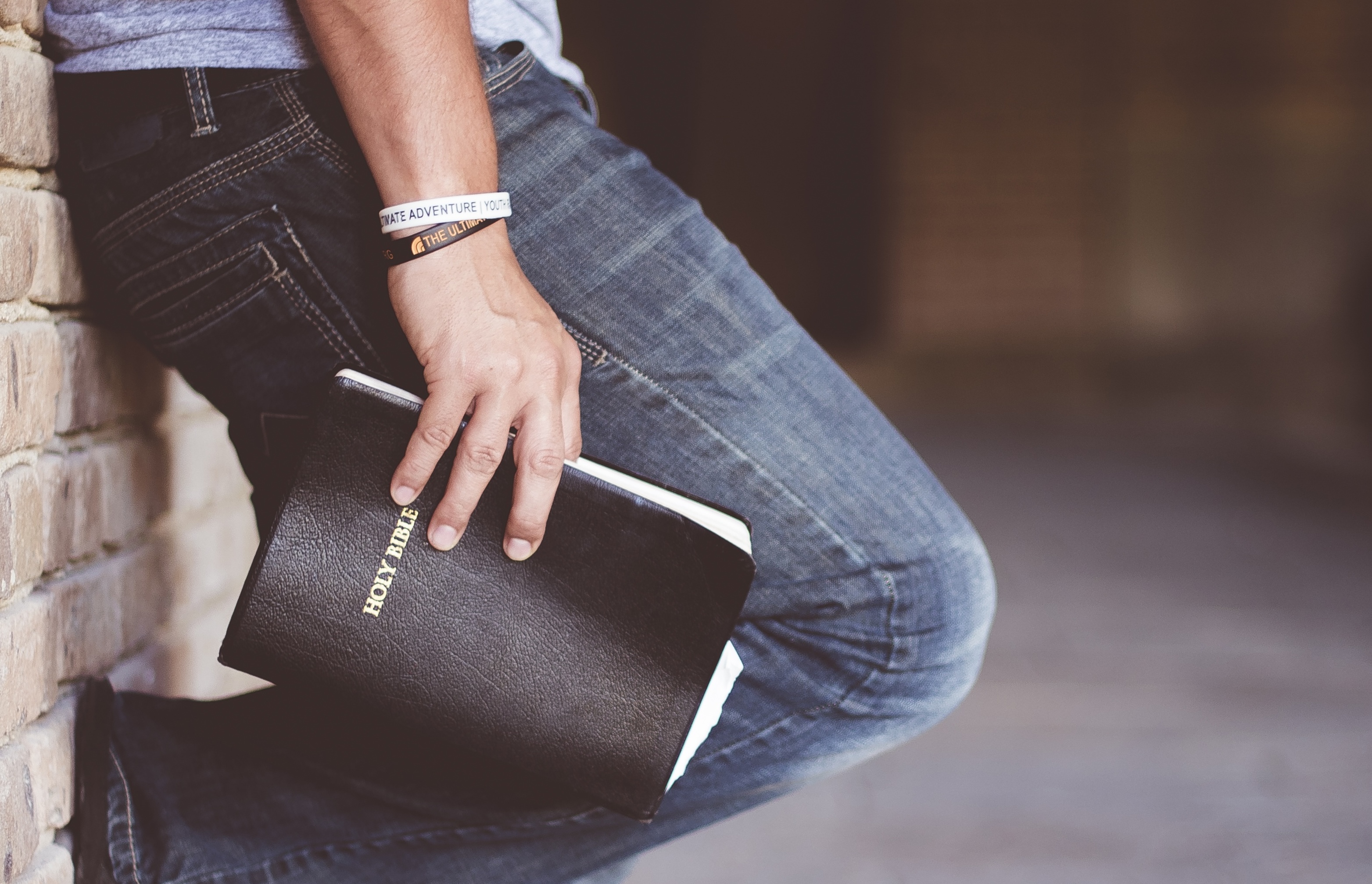 Bible being held by a man